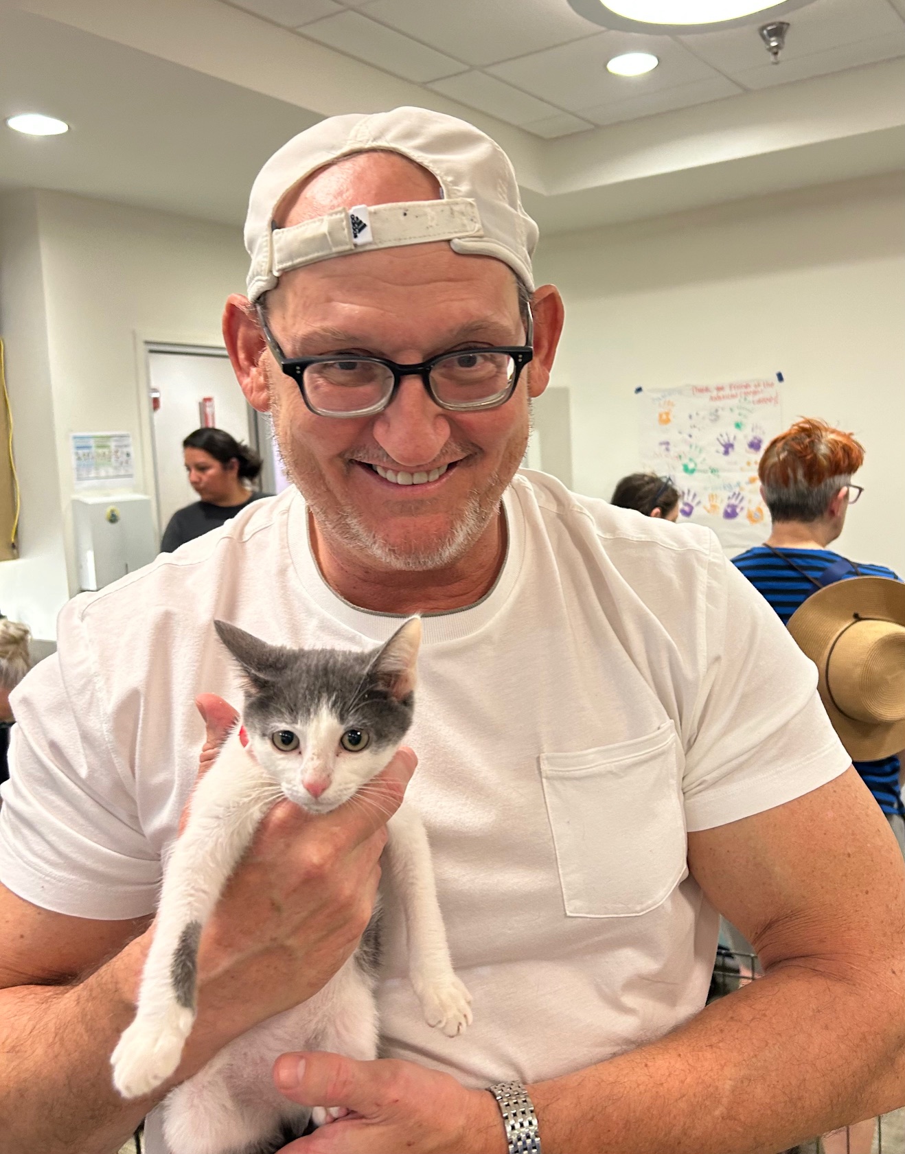 Bob Brich, of American Canyon, holds one of two cats he and his wife, Hilary, adopted Saturday at the American Canyon Library. Kerana Todorov photo
