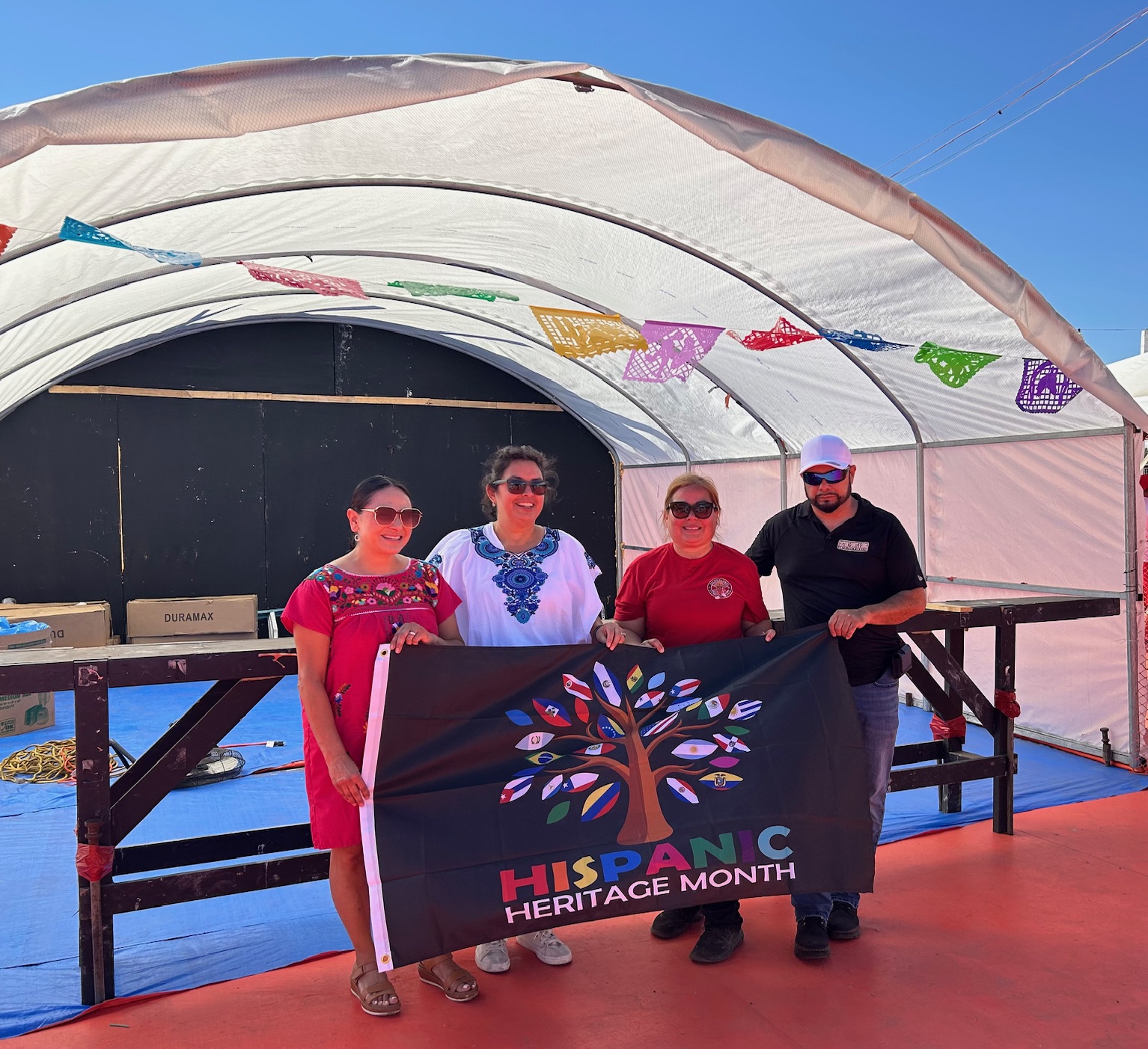 American Canyon resident and Napa County Supervisor Belia Ramos, left, stopped by the event that Karina Servente, Vanessa Lara and Hector Valencia, right, organized: the inaugural American Canyon Hispanic Heritage Day. Kerana Todorov photo