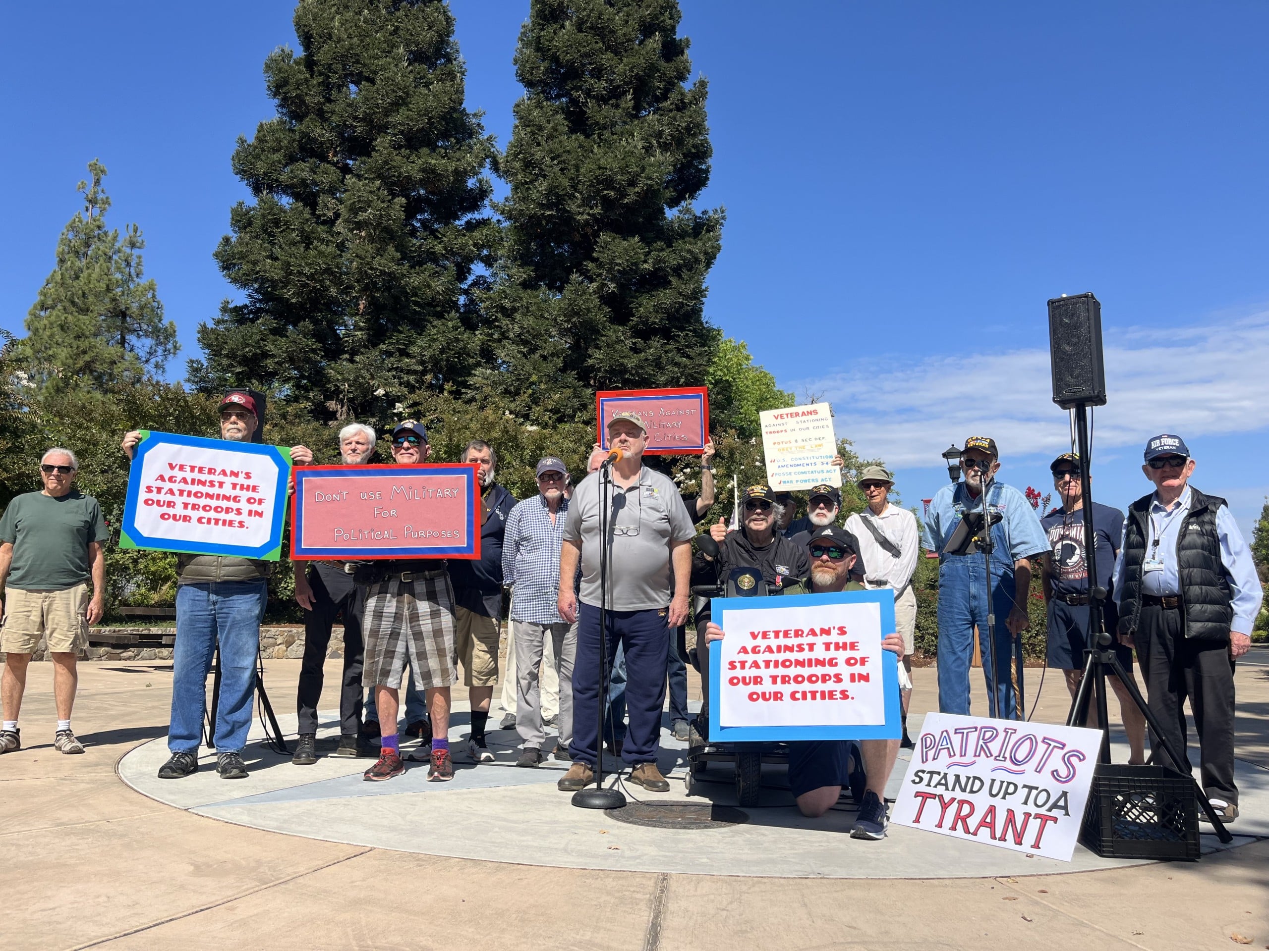 Yountville Veterans rally at Veterans Memorial Park against the deployment of National Guard troops in U.S. cities. David Boone, the event organizer, stands at the microphone. Griffin Jones photo
