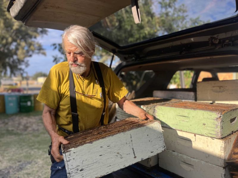 Spencer Marshall unloads the most recent haul of honey from Marshall’s Honey Farm hives. Griffin Jones photo