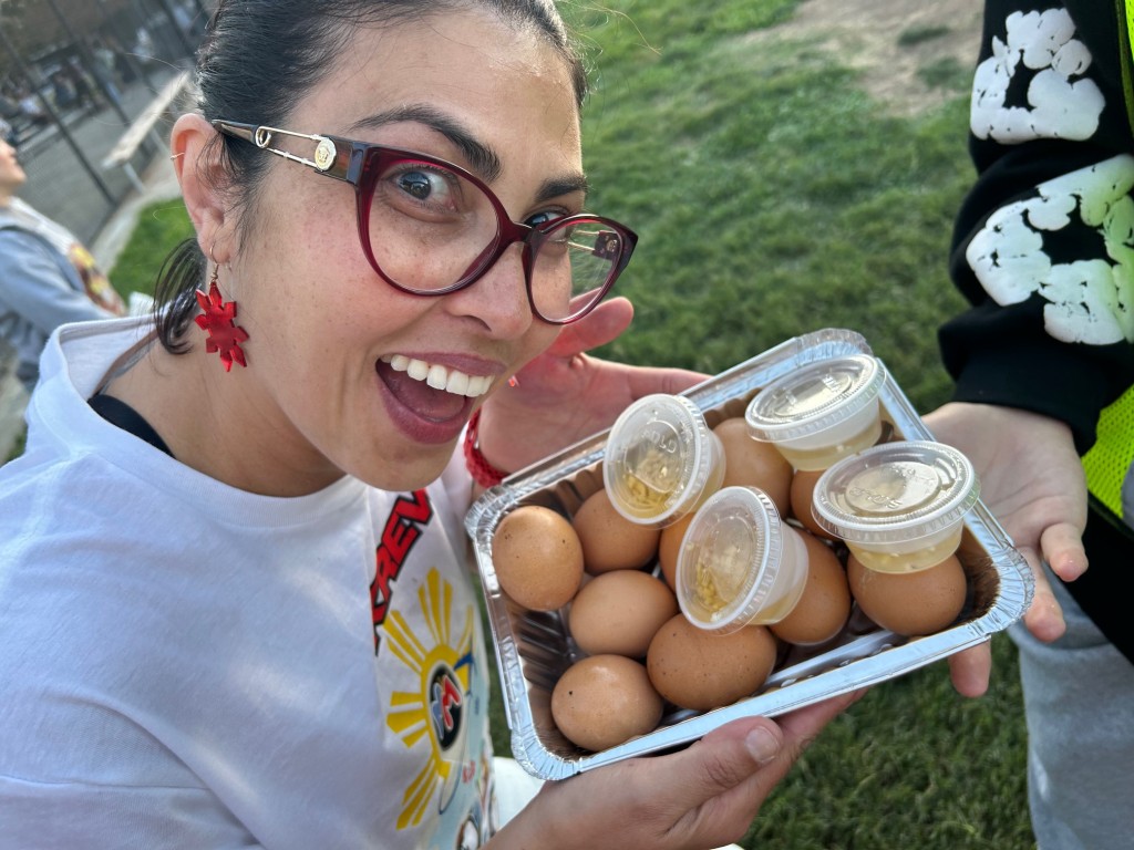 Saturday's Manila Munchies at Shenandoah Park included a balut contest. Volunteer organizer Sophie Borgeaud shows balut eggs, boiled fertilized duck eggs served with a vinegar-based sauce. Kerana Todorov photo