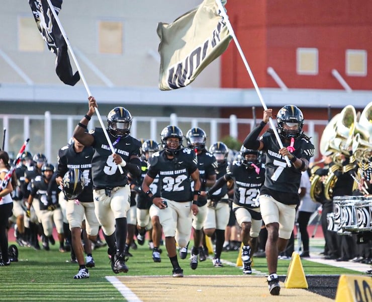 Evan Emmons, Lorenzo Seymour, Webster Burks, Miles Baylor leading up the celebration
