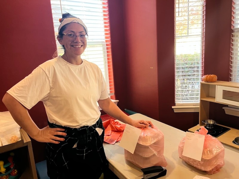 Jackie Beatty stands with her boxes of homemade dinners to be delivered to more than 100 people all over American Canyon and Solano County