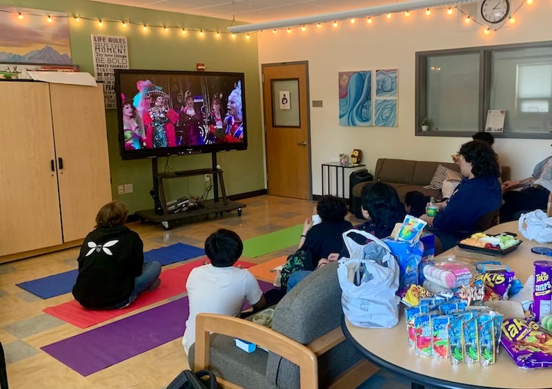 LGBTQ+ club members watching To Wong Foo, Thanks for Everything