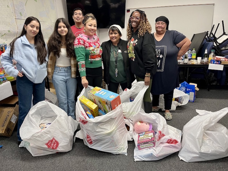 Toys for Tots volunteers Maria and Jocelyn DeHaro, Neil Nodado, Lissette Hernandez, Sherry Tennyson, Glynis Banks and Rhonda Zuniga