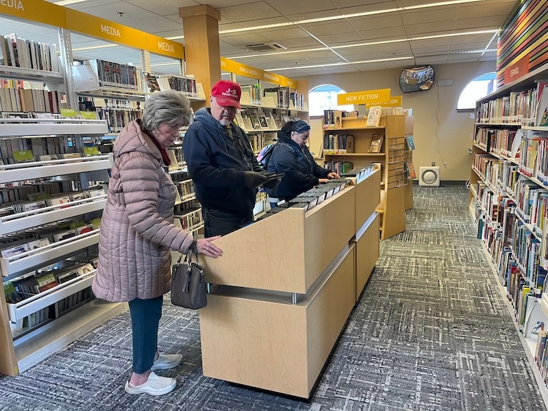 Patrons look through DVD rentals at the American Canyon Library