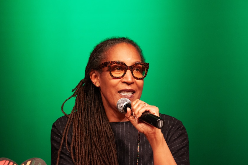 woman holding microphone onstage