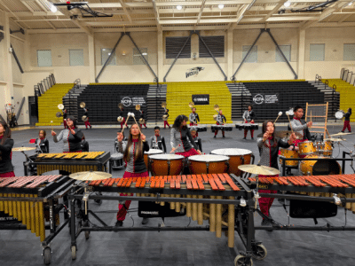students playing instruments in a gym