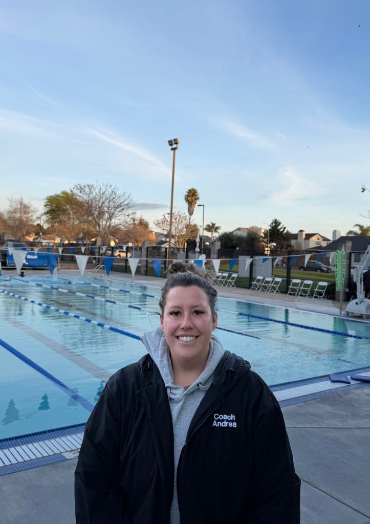 woman standing in front of pool