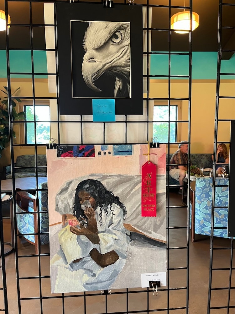 art hanging from a display case