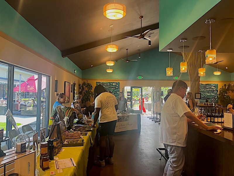 people looking at items on tables