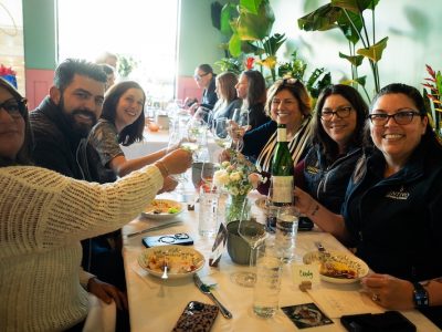 people cheersing at a dinner table