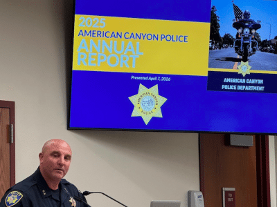 police officer standing talking at podium