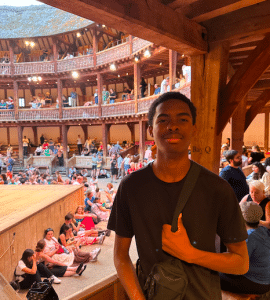 teenage boy standing in theater