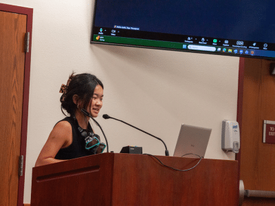 young woman speaking at meeting