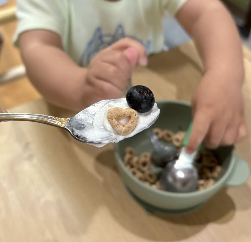 child eating cereal