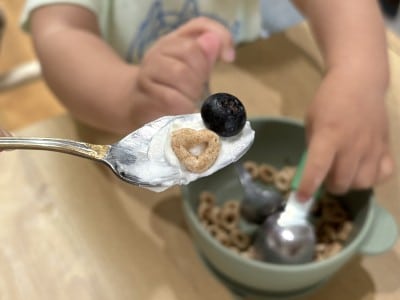 child eating cereal